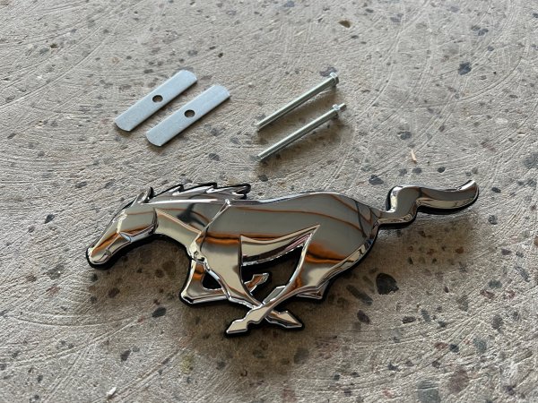 Running Pony emblem silver grille badge